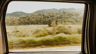 Car window looking out into the countryside