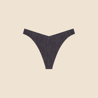 Netherlin's black seamless thong with extra thin waistband, made of aerated, quick-drying fabric and embedded with mineral fibers to inhibit odor and bacteria.